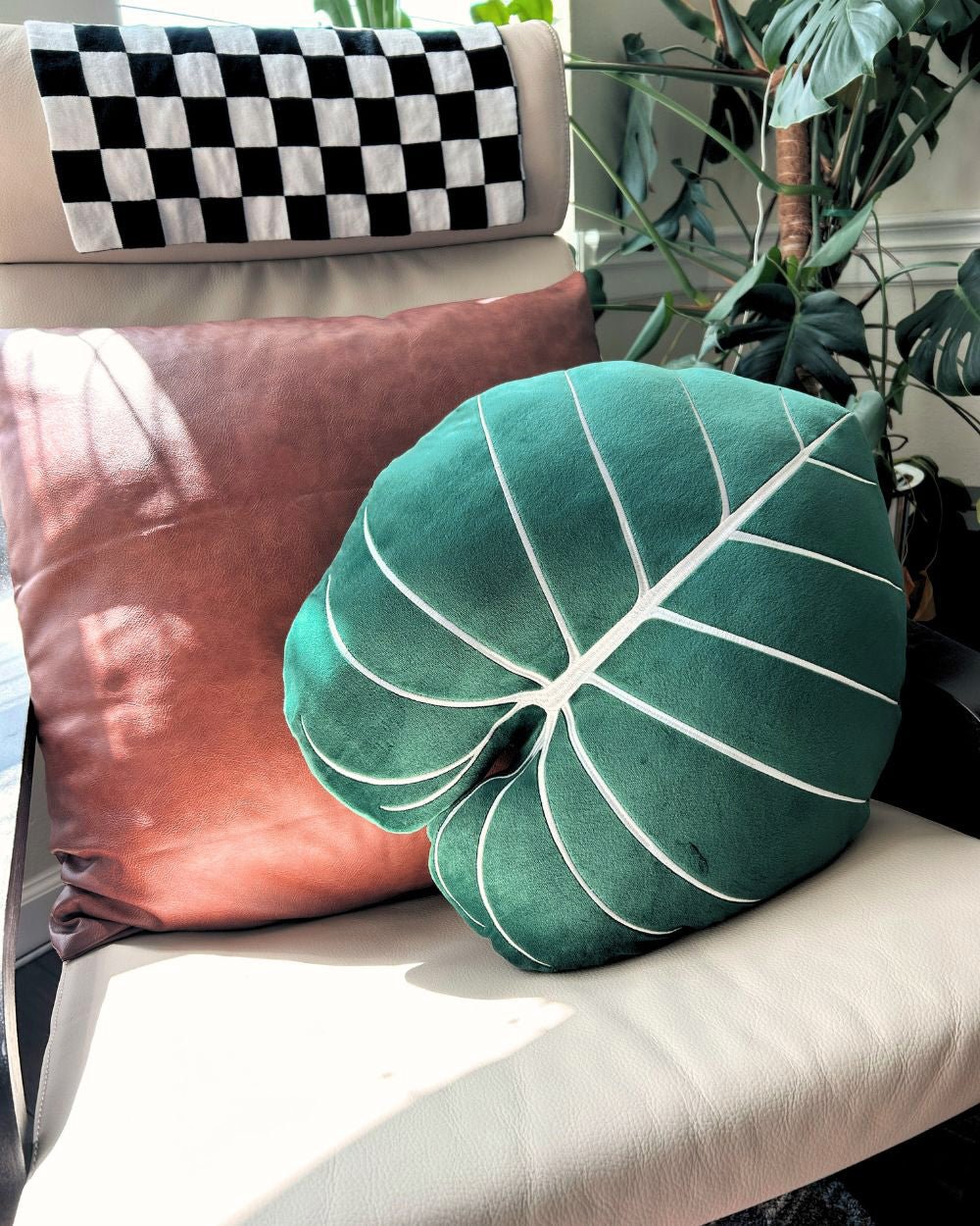 Lifestyle photo showing Philodendron Gloriosum Pillow - Forest Green in use - Green Philosophy Co.