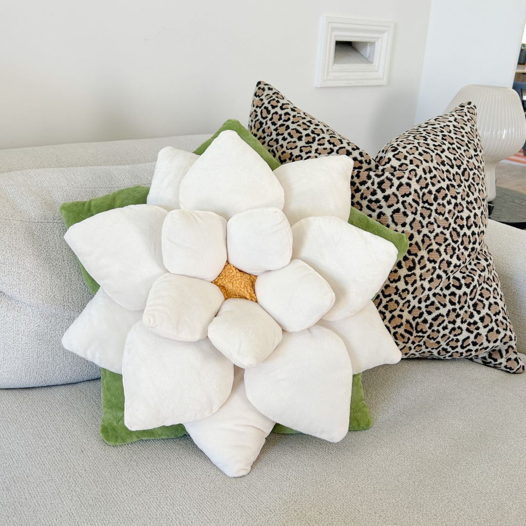 Lifestyle photo showing Poinsettia Pillow - Marshmallow White in use - Green Philosophy Co.