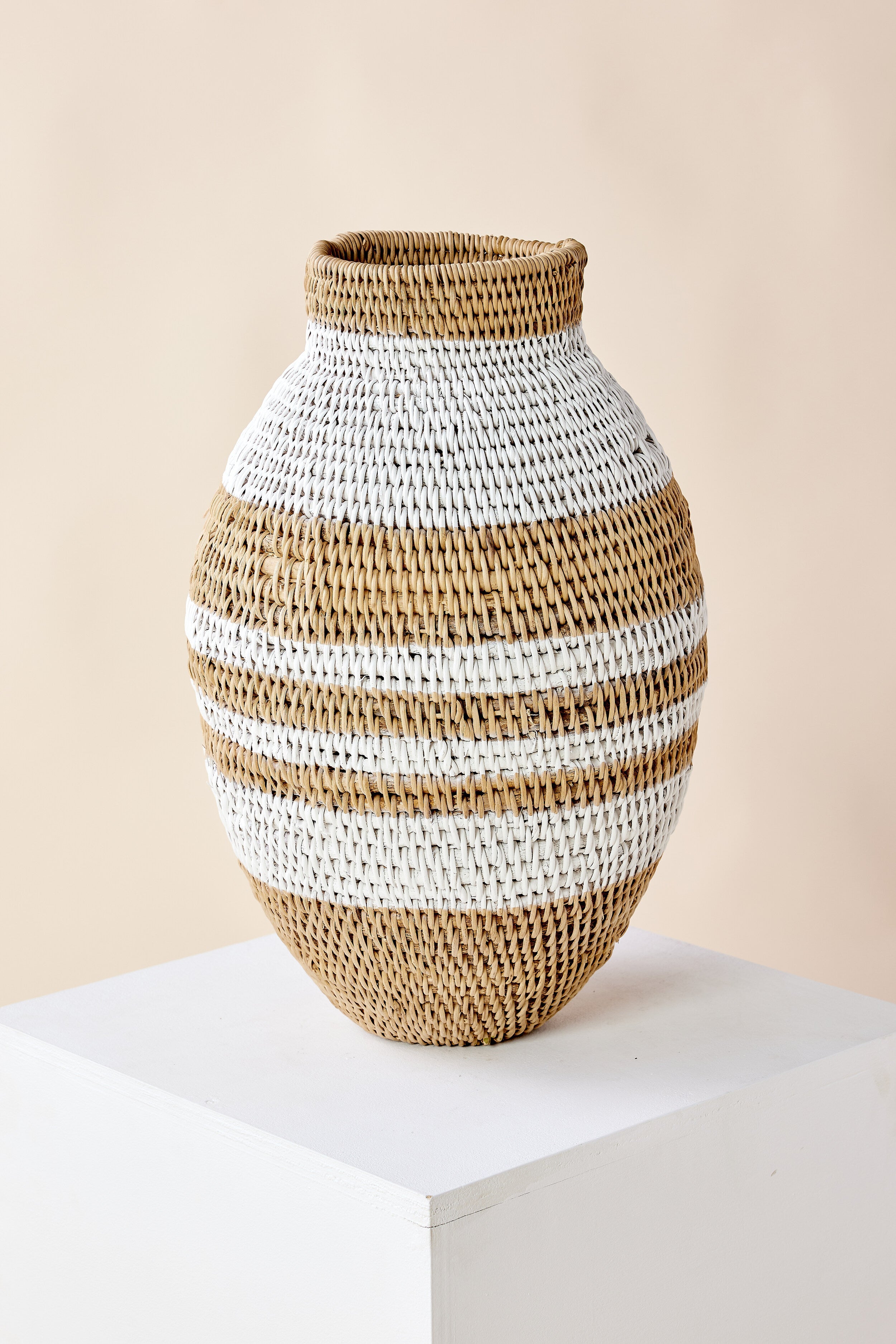 Lifestyle photo showing White Striped Buhera Basket in use - Kanju Interiors