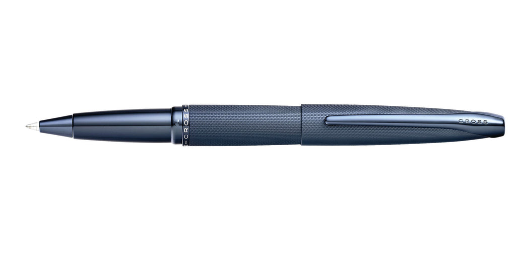 Lifestyle photo showing A.T. Cross ATX Sandblasted Dark Blue Rollerball Pen - Natural Lef in use - A.T. Cross